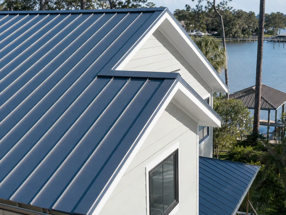 Finished standing seam metal roof on a Jacksonville home with clean ridge cap and gable trim alignment